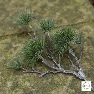 Faux evergreen branch for seasonal home decoration