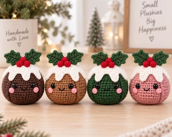 May include: Four round, crocheted plushies shaped like Christmas puddings, each featuring a white icing top, three red berries, and two green leaves. Each plushie has black safety eyes, a stitched smile, and pink cheeks in dark brown, tan, green, and pink.
