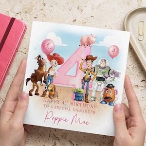 May include: A birthday card featuring Toy Story characters, including Woody, Buzz Lightyear, and Jessie, with a large pink number 4. The card reads "Happy 4th Birthday to a Special Daughter" and includes the name "Poppie Mae".