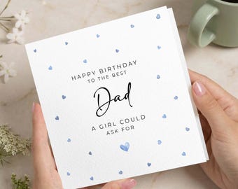 May include: A square white greeting card with a pattern of small light blue hearts. The text reads: HAPPY BIRTHDAY TO THE BEST Dad A GIRL COULD ASK FOR. The word Dad is written in a larger, black script font, while the other text is in a simple sans-serif font.