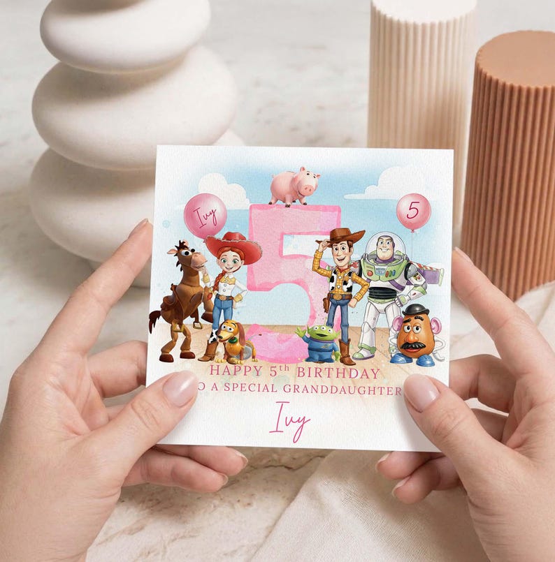 May include: A birthday card with Toy Story characters, a pink number 5, and balloons. The card reads "Happy 5th Birthday to a special granddaughter" and is personalized with the name "Ivy".