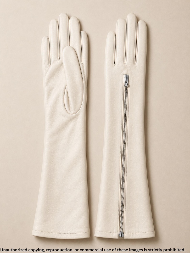 Elegant ivory long leather gloves handcrafted from premium soft Nappa leather with a full-length silver zipper. Luxury opera-length women's gloves featuring a full-finger design, perfect for bridal wear, formal occasions, evening fashion, driving, vintage style, and winter elegance.