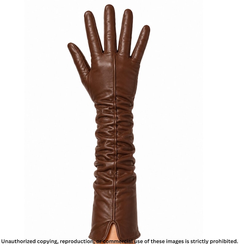 Brown long leather opera glove for women featuring ruched detailing, a raised center seam line, full fingers, and a small cuff slit.
