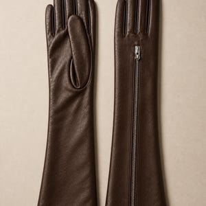 Handmade dark brown long leather gloves crafted from premium soft Nappa leather with a full-length silver zipper. Elegant opera-length gloves featuring a full-finger design, perfect for driving, evening wear, vintage fashion, luxury styling, winter outfits, and timeless wardrobe accessories.