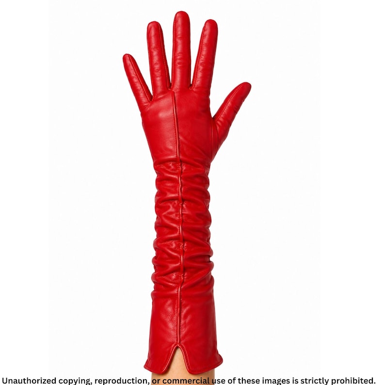 Red long leather opera glove for women with ruched detailing, a raised center seam line, full fingers, and a small cuff slit.