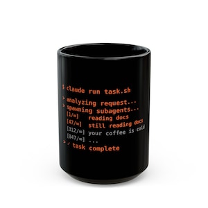 May include: A black ceramic mug featuring orange and white terminal command text that reads: $ claude run task.sh, > analyzing request..., > spawning subagents..., [1/∞] reading docs, [47/∞] still reading docs, [312/∞] your coffee is cold, [847/∞] ..., > ✓ task complete.