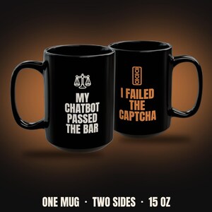 May include: A black 15 oz ceramic mug featuring two sides with text and graphics. One side displays a white scale of justice icon above the text MY CHATBOT PASSED THE BAR. The other side shows an orange traffic light icon above I FAILED THE CAPTCHA.