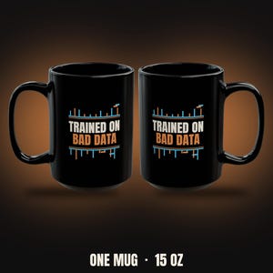 May include: Two black ceramic mugs, each with a capacity of 15 oz, featuring the white and orange text "TRAINED ON BAD DATA" centered on the front, accompanied by light blue and orange graphic line patterns above and below the text.