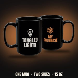 May include: A black ceramic mug with a 15 oz capacity, featuring two distinct sides. One side displays a white lightbulb icon above the text TANGLED LIGHTS. The other side shows an orange spiderweb icon above the text MY CODEBASE.