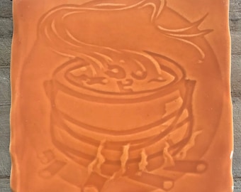 Handmade tile,  'Cauldron design in pumpkin colour glaze, made in UK