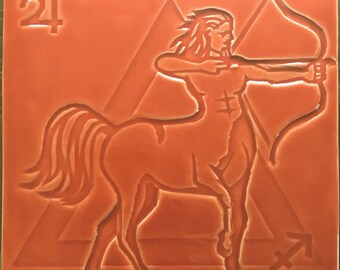 Handmade 'SAGITTARIUS' design tile In Flame Orange colour glaze,