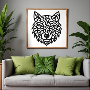 May include: A framed wall art piece featuring a black and white geometric wolf head design. The artwork is displayed above a gray sofa with green throw pillows. Potted plants flank the sofa, adding a natural element to the room.
