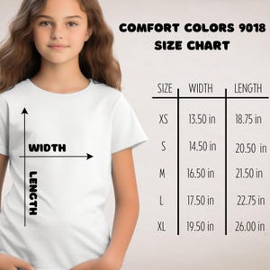 May include: A white t-shirt with a size chart for Comfort Colors 9018. The chart lists sizes XS to XL, with width measurements from 13.50 inches to 19.50 inches and lengths from 18.75 inches to 26.00 inches.