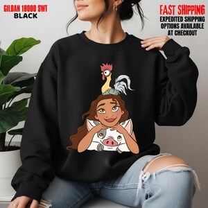 May include: Black crew neck sweatshirt featuring a cartoon character with long brown hair, a pig, and a rooster. The text "GILDAN 18000 SWT BLACK" is printed at the top left.