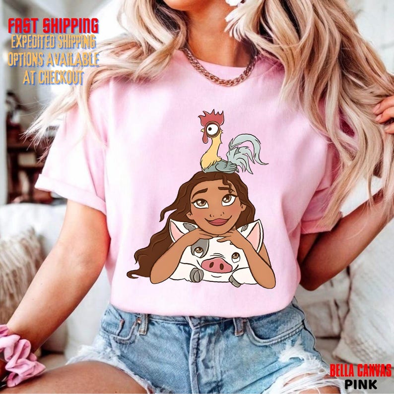 May include: Pale pink t-shirt with a cartoon illustration of a character, a pig, and a rooster. The shirt has the text "BELLA CANVAS PINK" at the bottom and "FAST SHIPPING EXPEDITED SHIPPING OPTIONS AVAILABLE AT CHECKOUT" at the top.
