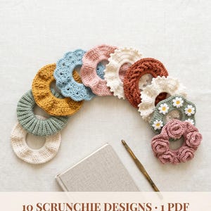 May include: A selection of ten colourful, handmade crochet scrunchies, including yellow, blue, pink, and white, arranged in an arc. A notebook and crochet hook are also visible. The text reads "10 SCRUNCHIE DESIGNS • 1 PDF".