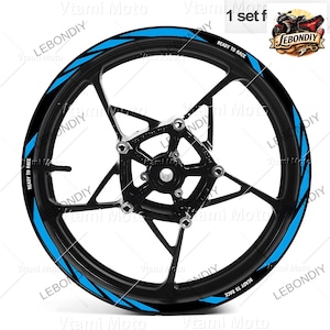 May include: A black motorcycle wheel with blue accent stripes and the text "READY TO RACE." The wheel has a star-shaped spoke design and is labeled with "LEBONDY" and "Vtami Moto."