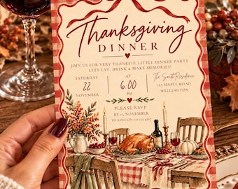 May include: A rectangular Thanksgiving dinner invitation card featuring a red and white gingham border with a red ribbon bow at the top and bottom. The text reads Thanksgiving Dinner, Join us for very thankful little dinner party, Saturday 22 November at 6:00 PM, The Smith Residence 123 Maple Road Wellington, and Please RSVP by 15 November to Rose on 021 123 4567.