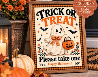 May include: A framed Halloween sign with a black and orange buffalo check border. The center features a white ghost wearing an orange plaid bow, holding a jack-o'-lantern bucket. Text reads: TRICK OR TREAT, Please take one, Happy Halloween!
