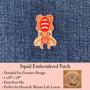 May include: An embroidered patch featuring a stylized squid with a light orange body, a darker orange head with white horizontal stripes, and two dark eyes. The patch measures 1-3/8 inches by 7/8 inches and is displayed against a dark blue denim fabric.