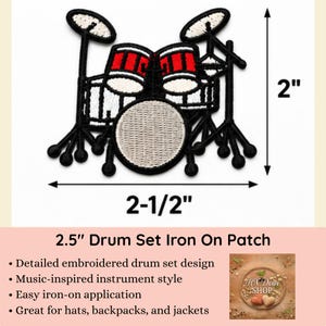 May include: An embroidered drum set patch featuring black, white, and red thread. The design includes a bass drum, two toms, and two cymbals with black stands. Dimension lines indicate a height of 2 inches and a width of 2.5 inches for the patch.