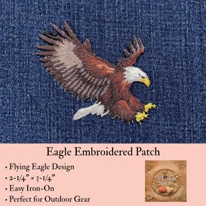 May include: An embroidered patch featuring a bald eagle in flight with brown, white, and yellow thread details. The patch measures 2-1/4 inches by 3-1/4 inches and is displayed against a dark blue denim fabric background.
