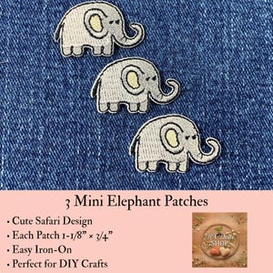 May include: Three embroidered elephant patches, each measuring 1-1/8 inches by 3/4 inches. The patches feature a light gray elephant with a pale yellow inner ear, black eye, and black outline, arranged in a diagonal pattern on a blue denim fabric.