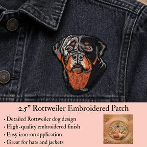 May include: A 2.5-inch embroidered patch featuring a detailed Rottweiler dog head with black and tan fur, applied to a dark gray denim jacket. The patch displays the dog's facial features, including brown eyes, a black nose, and tan markings.