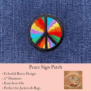 May include: A circular embroidered patch featuring a black peace sign symbol filled with vibrant, multi-colored rainbow segments in red, orange, yellow, green, blue, and purple. The patch has a black stitched border and measures 2 inches in diameter.