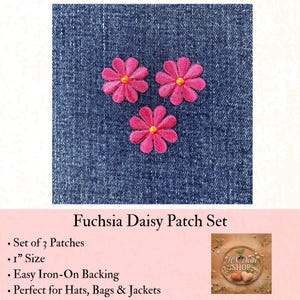 May include: A set of three fuchsia daisy patches with yellow centers, each measuring 1 inch in size. These embroidered floral appliques feature an iron-on backing and are displayed against a dark blue denim fabric background.