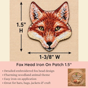 May include: An embroidered fox head patch featuring orange, white, and black thread details. The patch measures 1.5 inches in height and 1-3/8 inches in width. The design includes pointed ears, green eyes, and a black nose on a textured background.