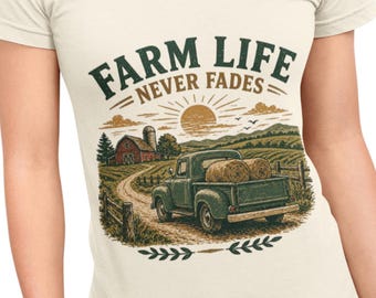 May include: Cream-colored t-shirt featuring a graphic of a farm scene with a green pickup truck carrying hay bales. The text "FARM LIFE NEVER FADES" is arched above the scene, with a sun and birds in the background.