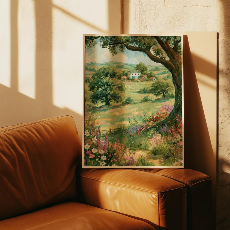 Pode incluir: Uma impress&atilde;o de arte de parede retangular emoldurada apresentando uma pintura de paisagem de uma casa de campo branca situada em colinas verdes. O primeiro plano exibe um prado vibrante cheio de flores silvestres coloridas e um grande galho de &aacute;rvore emoldurando a cena.