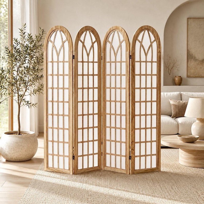 May include: A four-panel folding room divider constructed from light-toned wood. Each panel features an arched top with a grid-like lattice design and white fabric inserts. The structure is freestanding and consists of four hinged sections.