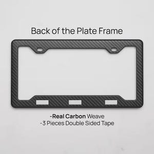 May include: A black carbon fiber license plate frame with a woven texture. The frame has a rectangular shape with rounded corners and three rectangular cutouts at the bottom. Text on the image reads "Back of the Plate Frame", "-Real Carbon Weave", and "-3 Pieces Double Sided Tape".