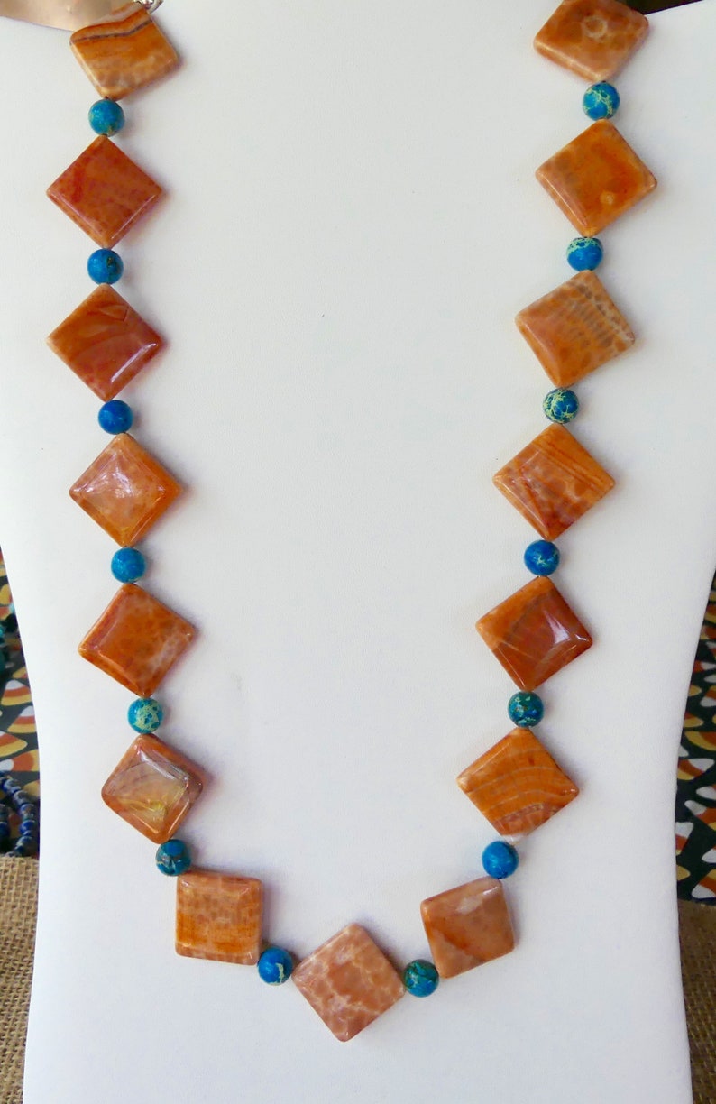 24 Inch Orange and White Crab Agate with Blue Sea Sediment Accents with Earrings