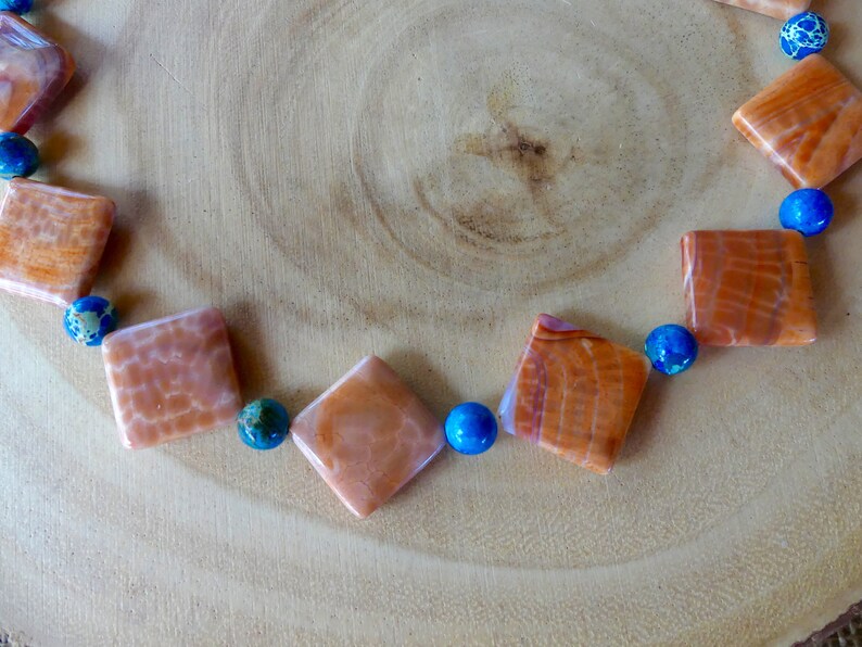 24 Inch Orange and White Crab Agate with Blue Sea Sediment Accents with Earrings