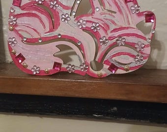 Decorative pink and silver sleeping cat figurine