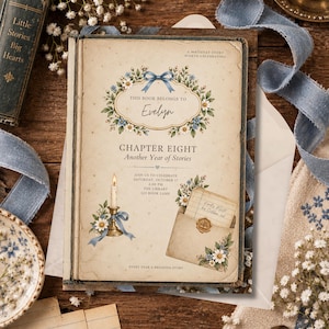 May include: A rectangular birthday invitation card featuring a vintage book cover design with a floral wreath, a blue bow, a lit candle in a brass holder, and an envelope with a wax seal. The text reads: This book belongs to Evelyn, Chapter Eight, Another Year of Stories, Join us to celebrate Saturday, October 17, 2:00 PM, The Library, 125 Book Lane, A birthday story worth celebrating, Every year a brighter story.