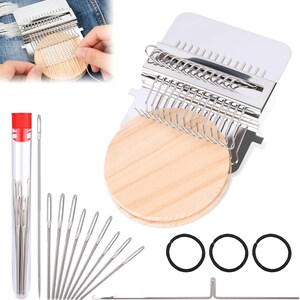 May include: A weaving loom kit with a metal frame, wooden circular bases, and needles. The kit includes a clear tube with a red cap containing needles, along with black rubber bands and a metal hook. The loom is shown in use.