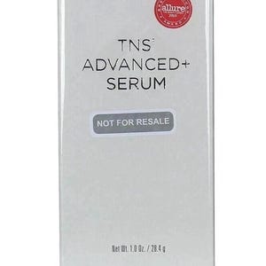 May include: A rectangular SkinMedica TNS Advanced+ Serum box in white with a silver base. The front features the brand logo, an Allure 2019 award seal, the product name, a Not For Resale label, and the net weight of 1.0 Oz. / 28.4 g.