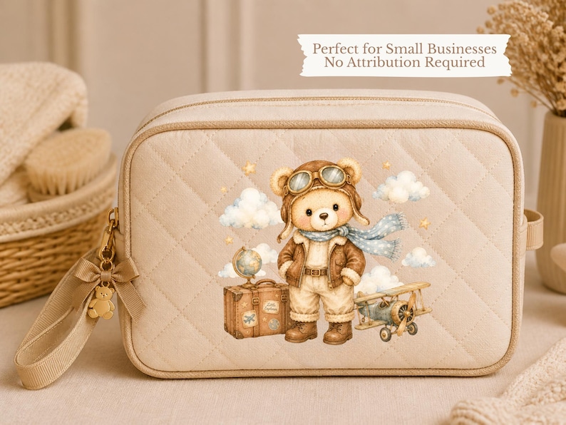 May include: A beige quilted rectangular cosmetic bag with a zipper closure and a small bear-shaped charm. The front features a printed illustration of a bear dressed as an aviator with a globe, a suitcase, and a small airplane among clouds.