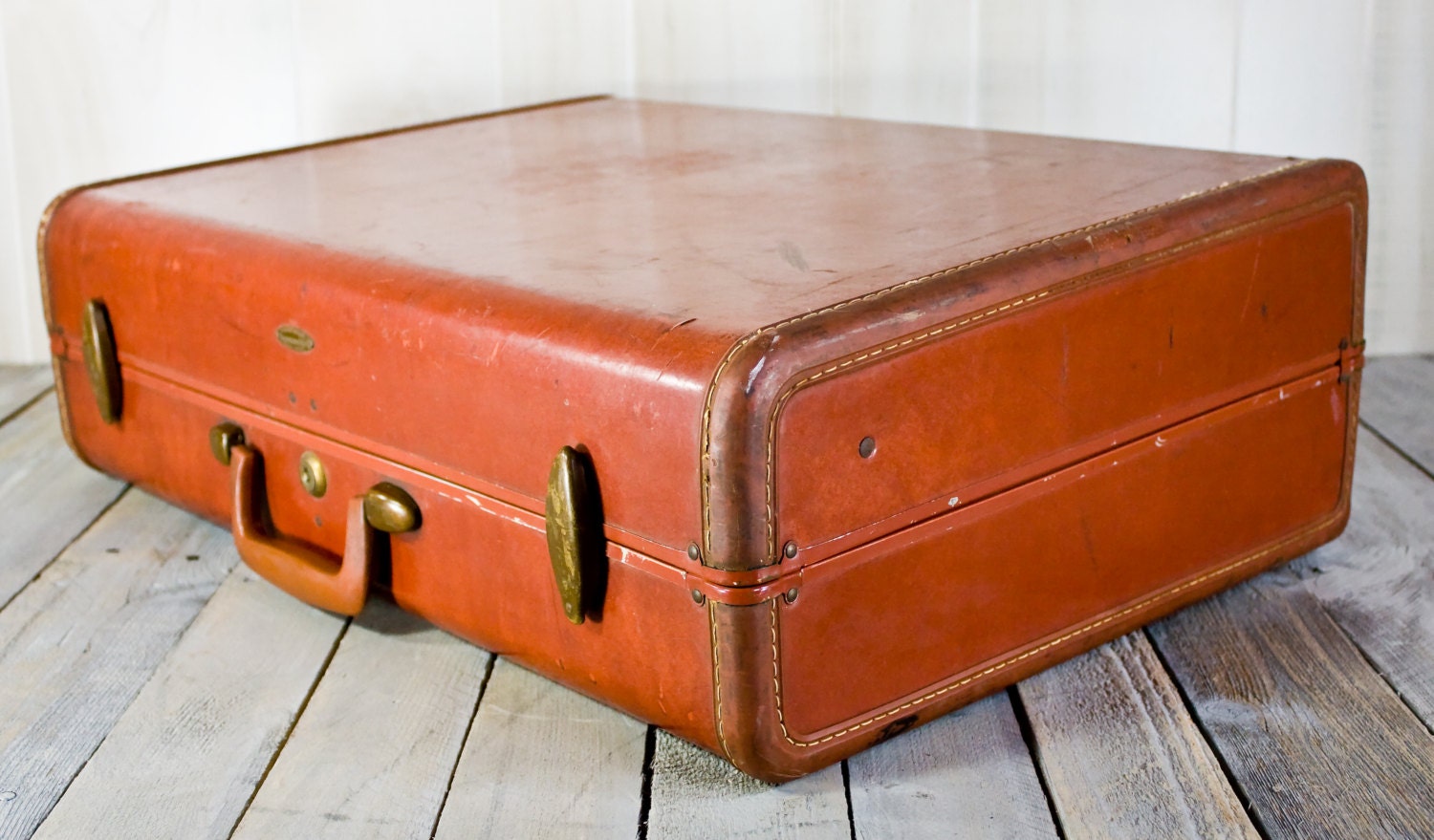 white luggage with brown trim
