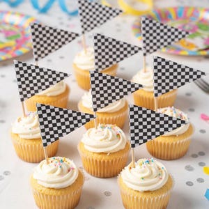 May include: A white ceramic mug with a black handle and the text "But First, Coffee" in a black, bold font. The mug is on a white surface.