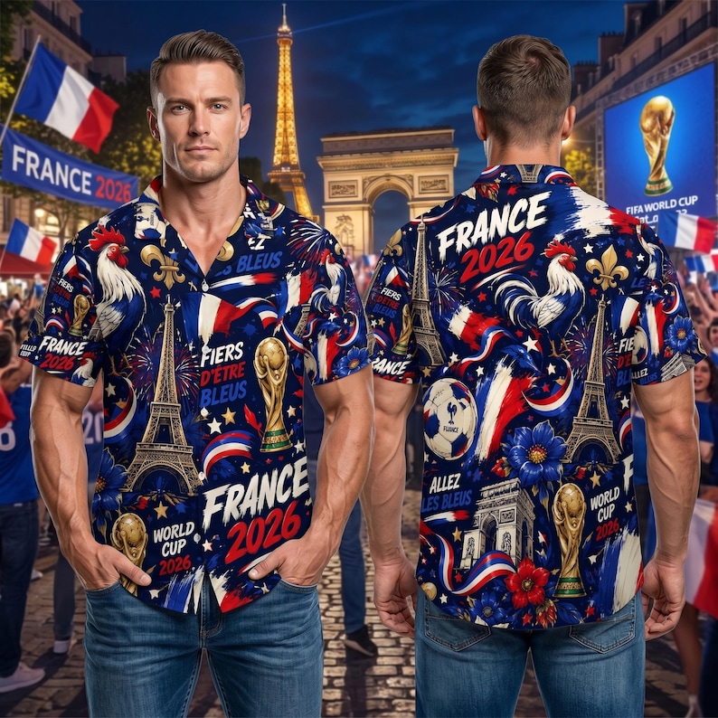 May include: A short-sleeved button-down shirt with a navy blue background, featuring a design of the Eiffel Tower, a soccer ball, and the text "France 2026". The shirt's design incorporates the colors red, white, and blue.