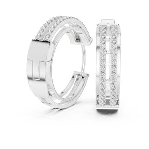 May include: A pair of silver-toned hoop earrings featuring a double-row design encrusted with small clear stones. The earrings have a polished metallic finish with a smooth rectangular section on the side and a hinged closure mechanism.