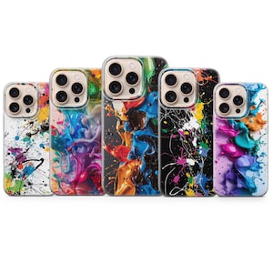May include: A collection of five phone cases with vibrant abstract paint splash designs. Each case features a different color scheme, including white, black, and clear backgrounds with splatters of yellow, blue, orange, and purple. The cases are designed for a smartphone.