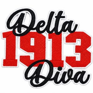 May include: An embroidered patch featuring the word Delta in black script above the red block numbers 1913, followed by the word Diva in black script at the bottom. The entire design is outlined in white thread against a plain white background.