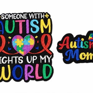 May include: Two embroidered patches with black backgrounds. The larger patch features a colorful heart made of puzzle pieces, red ribbons, and the text "SOMEONE WITH AUTISM LIGHTS UP MY WORLD". The smaller patch features a puzzle-patterned bow and "Autism Mom".
