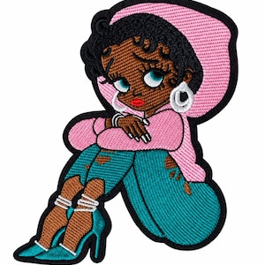 May include: An embroidered patch featuring a cartoon character with dark skin, black hair, and blue eyes. The character wears a pink hooded sweatshirt, distressed teal jeans, and teal high-heeled shoes with white ankle straps, accented by silver hoop earrings.
